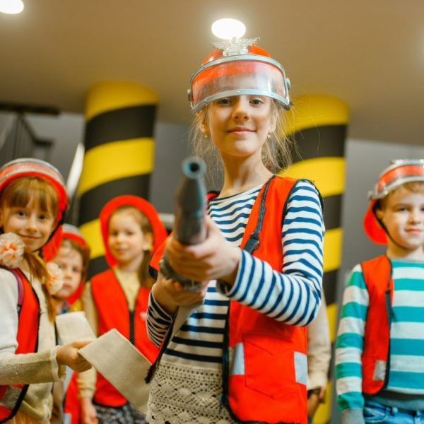 child-with-hose-in-hands-playing-firefighter