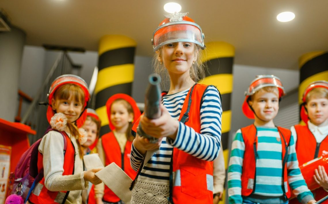 child-with-hose-in-hands-playing-firefighter