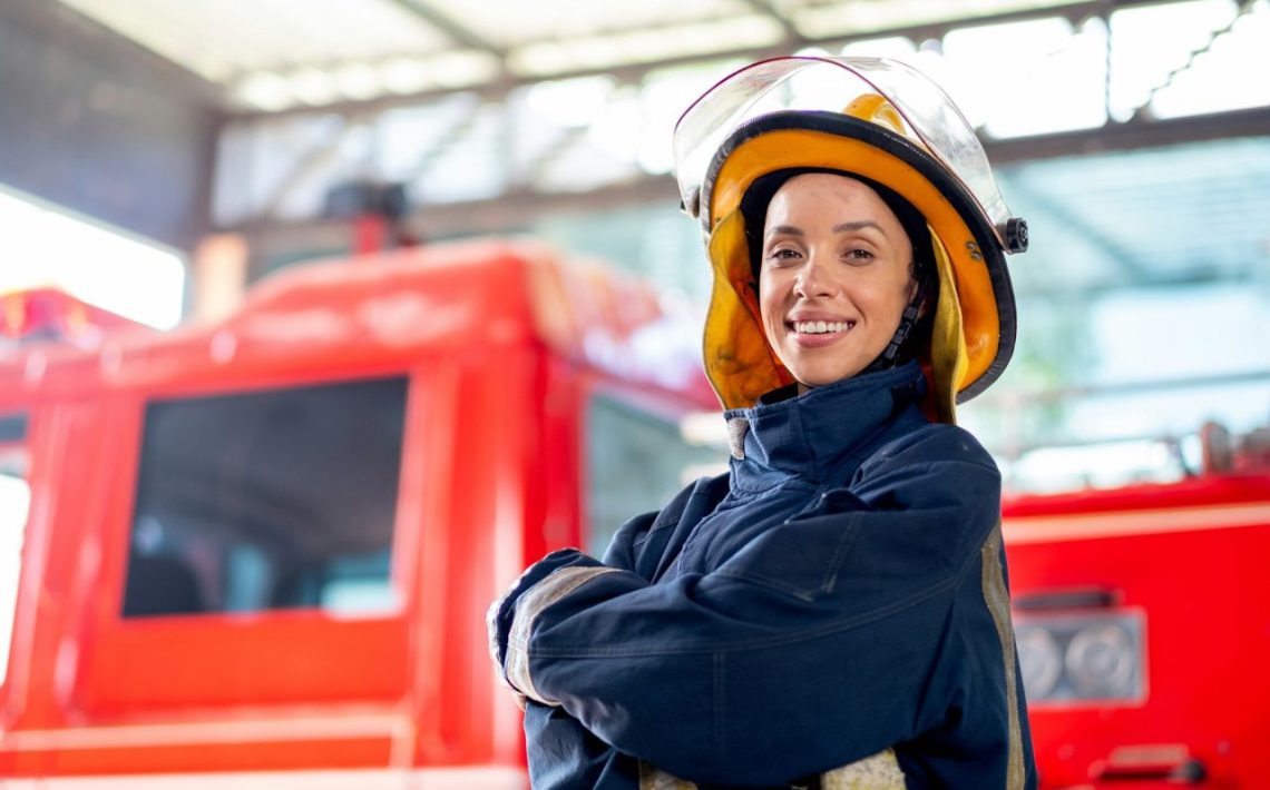 side-view-of-fireman-or-firefighter-woman-with-protective-clothes-stand-with-confidence